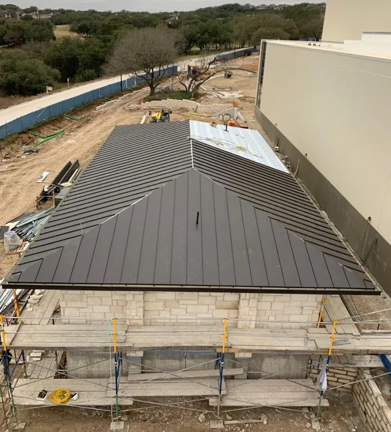 Metal roof new construction with scaffolding in Royal Kunia